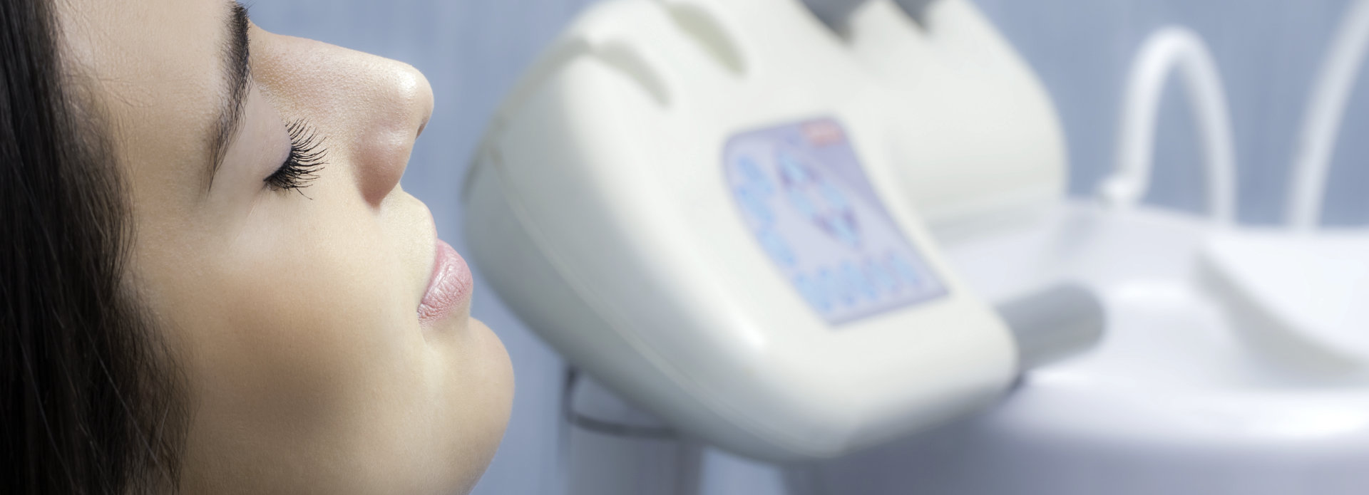 A woman in a dental chair under dental sedation Buford GA