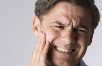 man suffering from toothache