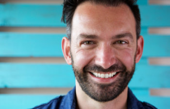 smiling man with beard and nice teeth