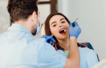 Dentist performing Dental Checkups Buford oral exam procedure